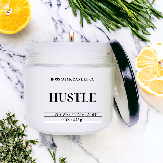 Experience the invigorating aroma of Hustle, a scented candle infused with lemon grass and citrus to brighten and uplift your space. With herbal undertones, this candle will inspire you to take on the day with energy and positivity. Light up your hustle, light up your life!