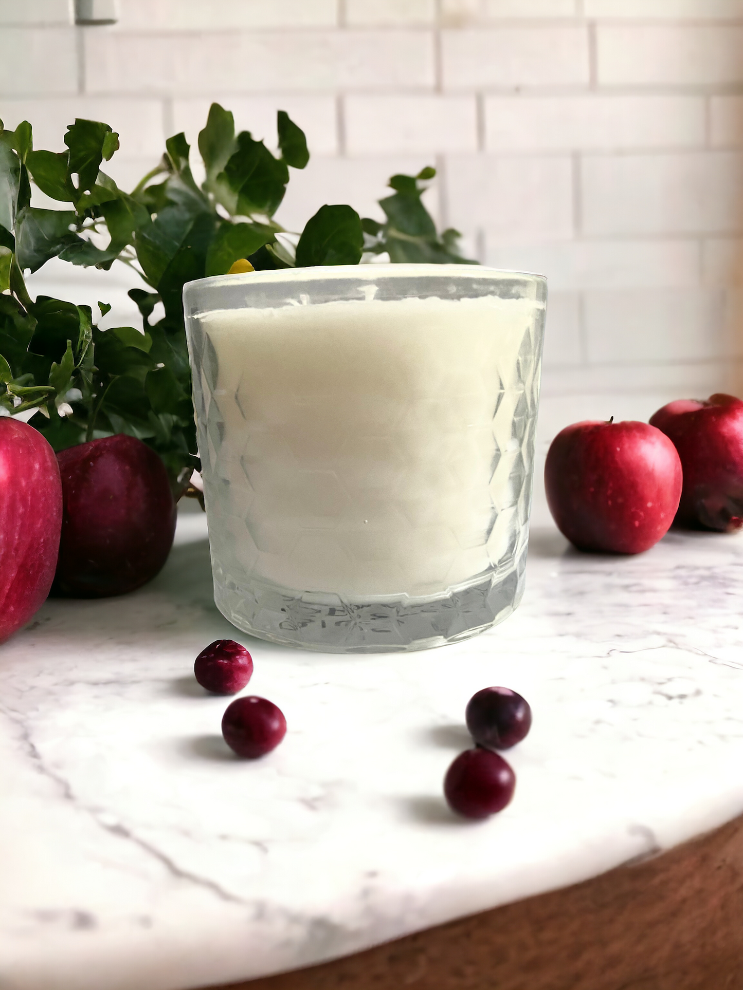 Indulge in the warm and inviting fragrance of our Cranberry Apple 3 wick scented candle. The perfect addition to your cozy evening ritual, this candle creates a cozy ambiance while filling your home with the delicious scent of cranberries and crisp juicy red apples. Made with 3 wicks for even burning and long lasting enjoyment.