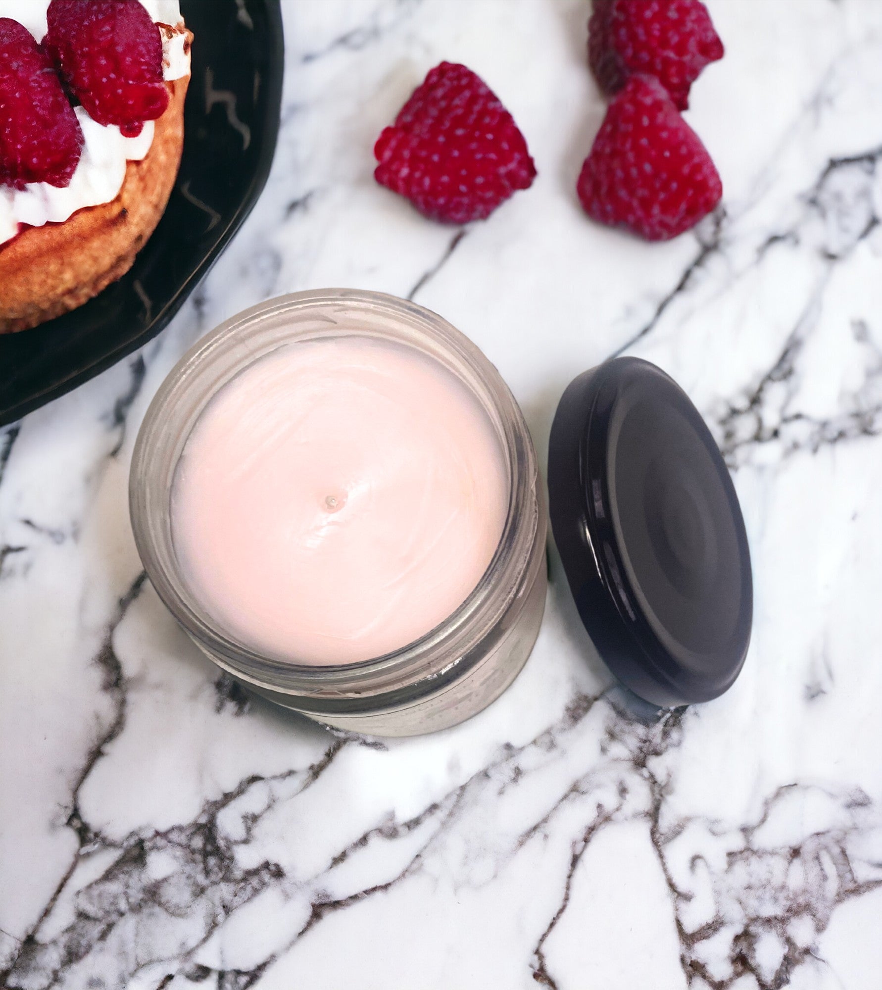 Indulge in the luscious scent of Raspberry Delight with this single wick, soy wax blend scented candle. Bursting with bright citrus, vanilla, and juicy raspberry, it's perfectly balanced with hints of fresh berries and a creamy buttery blissful dessert . Let this thoughtfully crafted accord transport you to a fruit-filled fantasy.